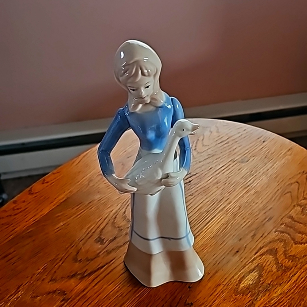 Lladro girl holding goose